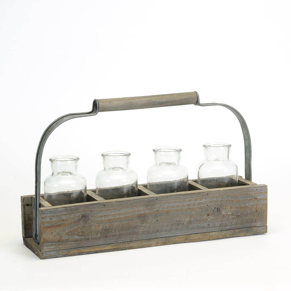Wooden crate with glass jars on a white background