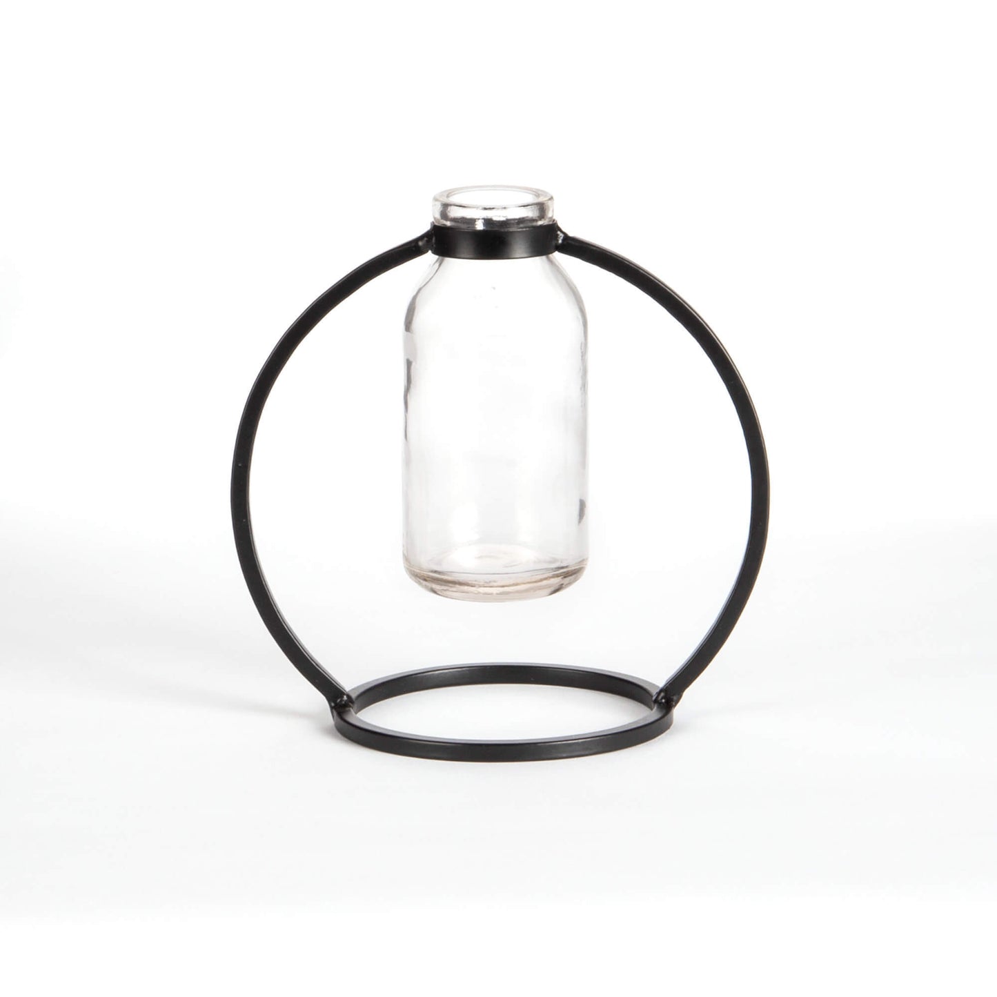 Glass bottle held by a black metal ring on a white background