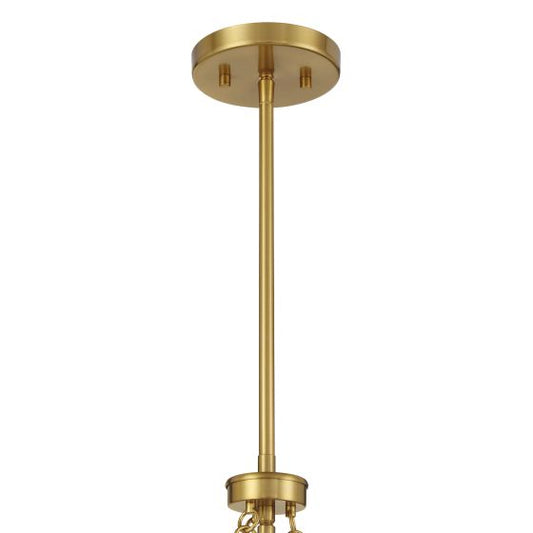 Gold pendant light fixture on a white background