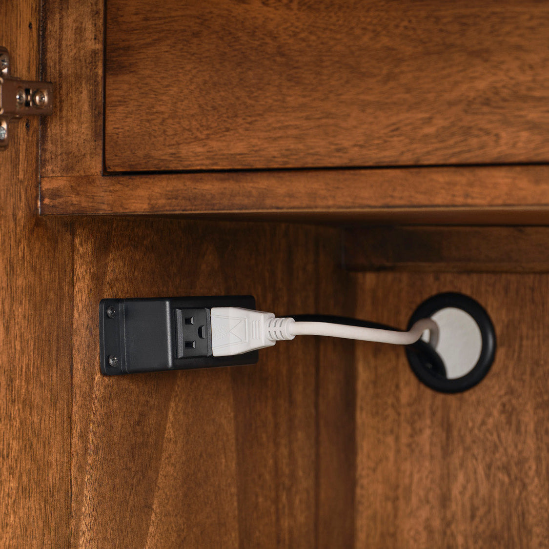 USB cable plugged into a device on a wooden surface