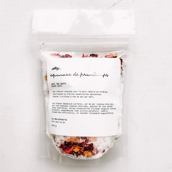 Packaged bath salt with a label on a white background
