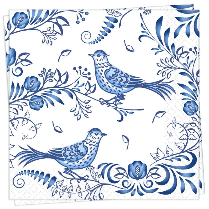 Napkin with blue floral and bird design on a white background