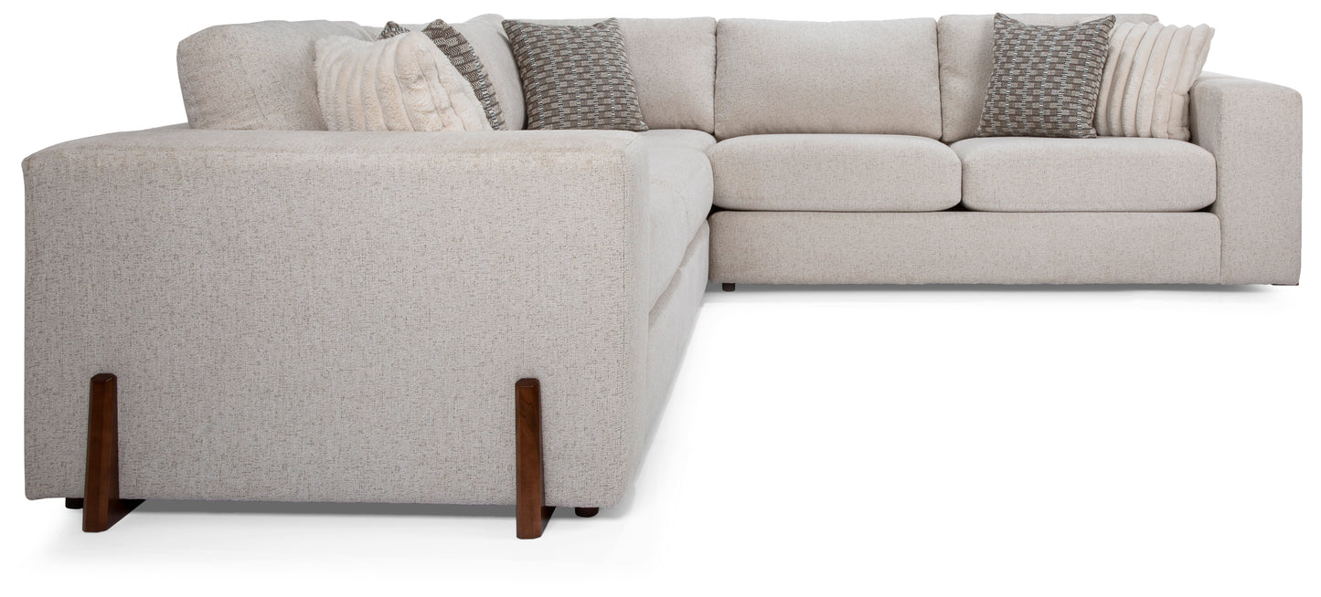 Gray sectional sofa with wooden legs on a white background