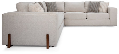 Gray sectional sofa with wooden legs on a white background