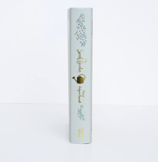 Light blue cylindrical product packaging with floral designs and text on a white background