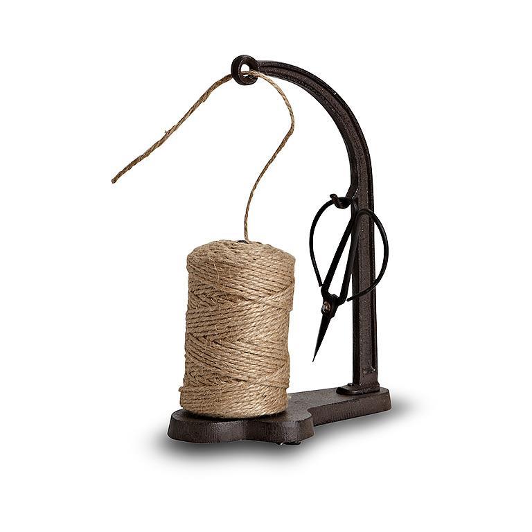 Spool of twine with a metal holder on a white background