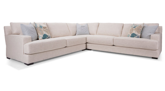 Beige sectional sofa with decorative pillows on a white background