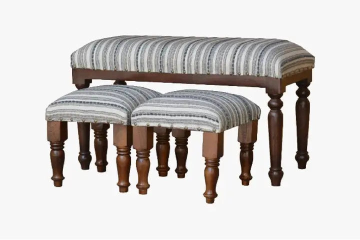 Set of three upholstered benches with striped pattern and wooden legs on a white background