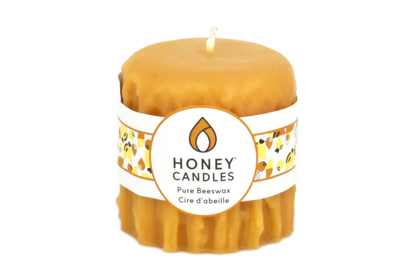 Honey candle with a label on a white background