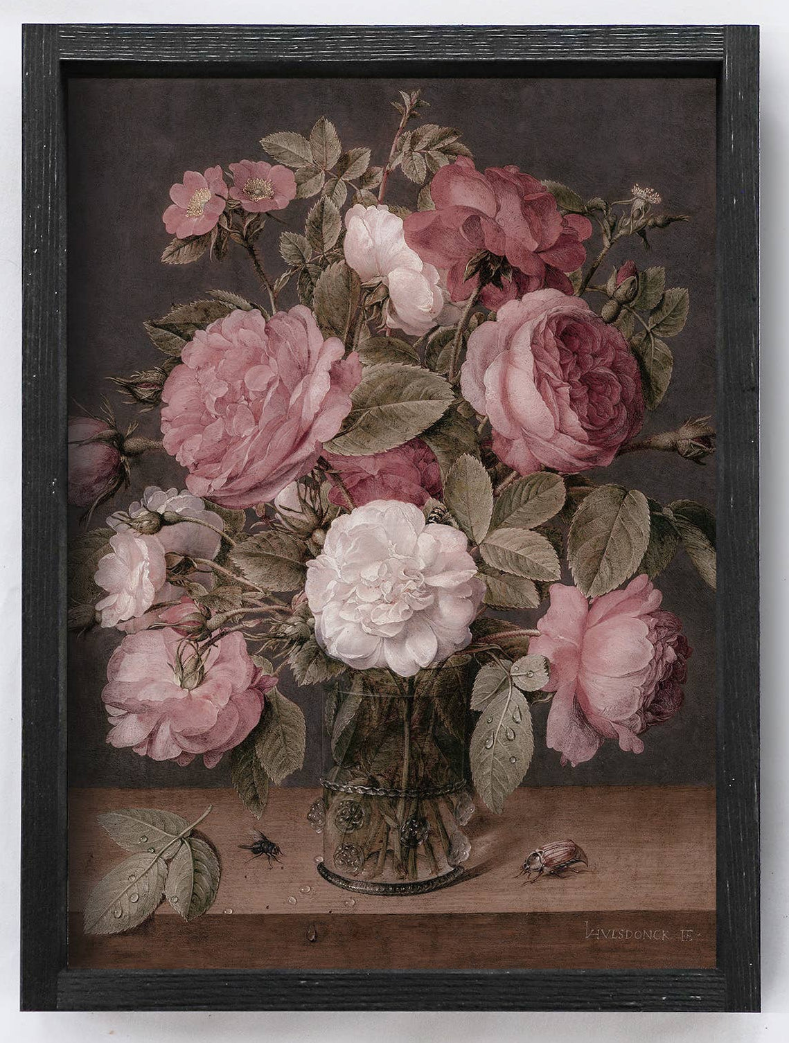 Framed artwork of pink and white flowers in a glass vase on a white background