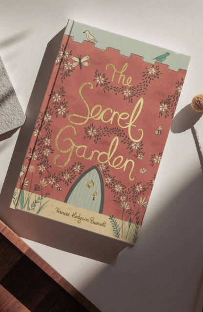 Book titled 'The Secret Garden' with floral design on a white surface
