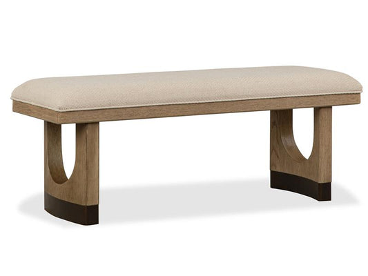 Beige upholstered bench with wooden legs on a white background