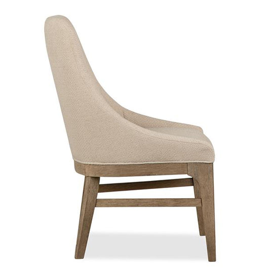 Beige upholstered chair with wooden legs on a white background