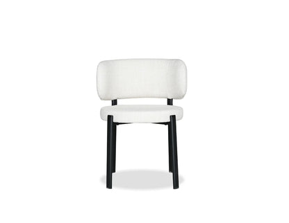 White chair with black legs on a white background