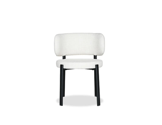 White chair with black legs on a white background