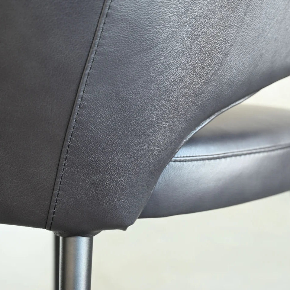 Close-up of a gray chair with a blurred background