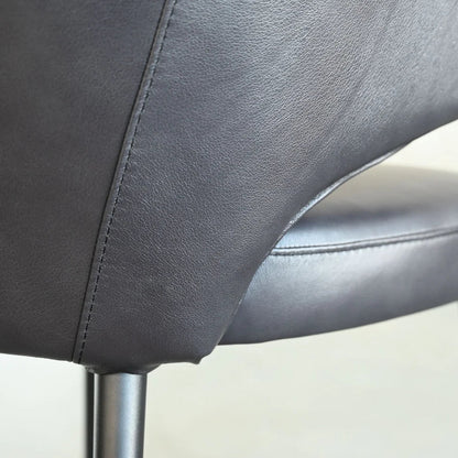 Close-up of a gray chair with a blurred background