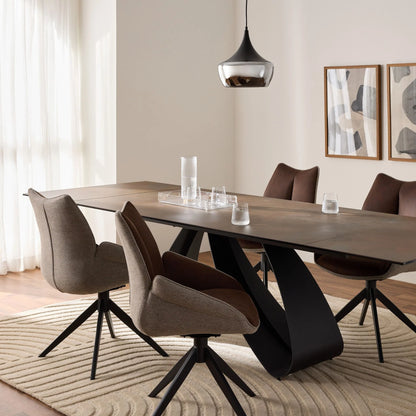 Modern dining room with a long ceramic  table and chairs.