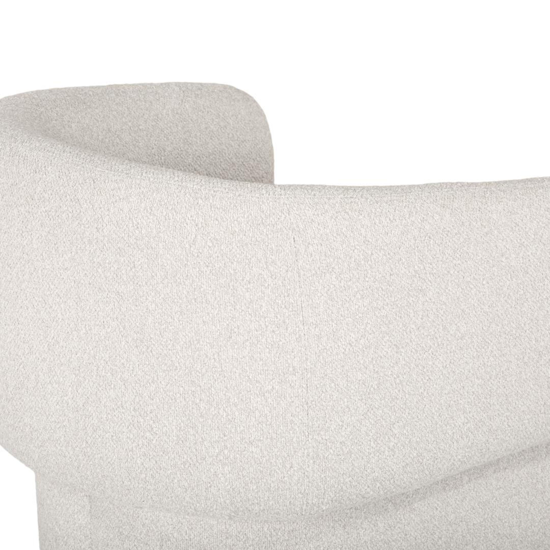 Close-up of a textured gray sofa armrest on a white background
