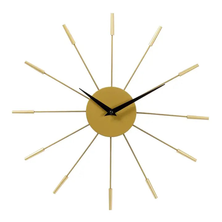 Gold wall clock with black hands on a white background