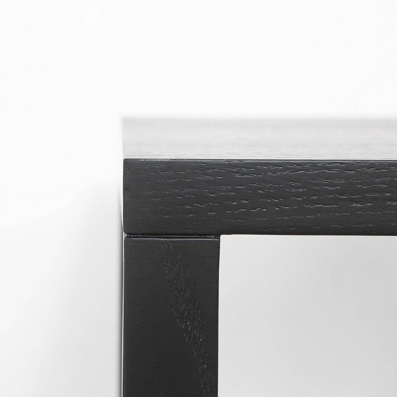 Close-up of a black frame corner on a white background