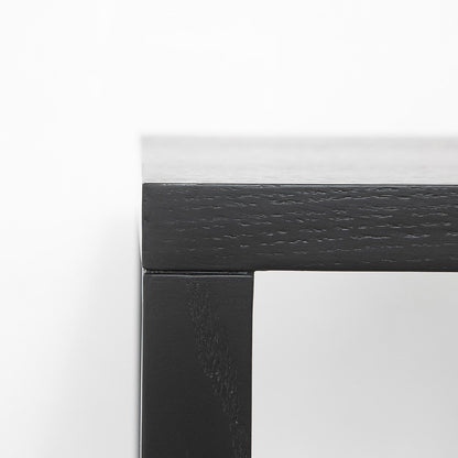 Close-up of a black frame corner on a white background