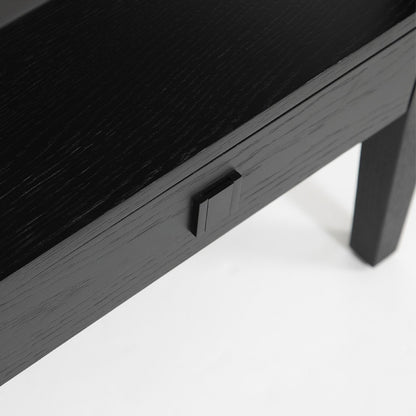 Black wooden desk with a power outlet on a white background