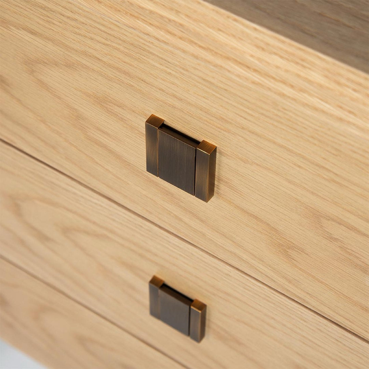 Close-up of wooden drawer with metal handles