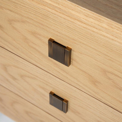 Close-up of wooden drawer with metal handles