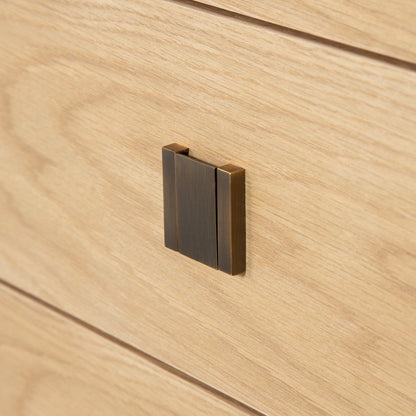 Wooden drawer with a metallic handle