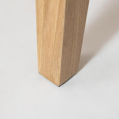 Close-up of a wooden leg on a white background