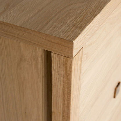 Close-up of a wooden cabinet corner with a smooth finish