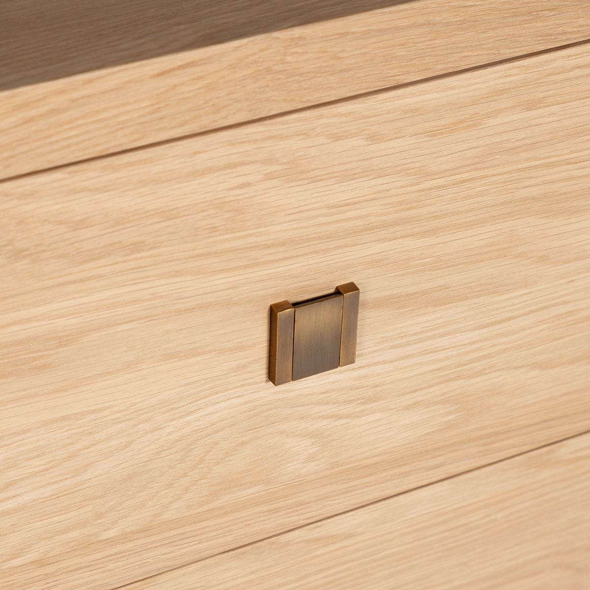Wooden surface with a brass handle