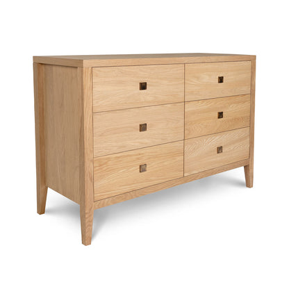 Wooden dresser with four drawers on a white background