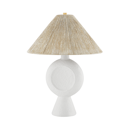 Table lamp with a textured beige shade on a white background