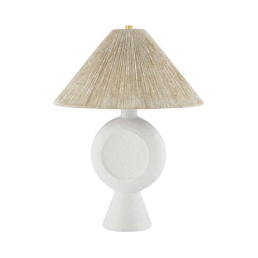 Table lamp with a textured beige shade on a white background