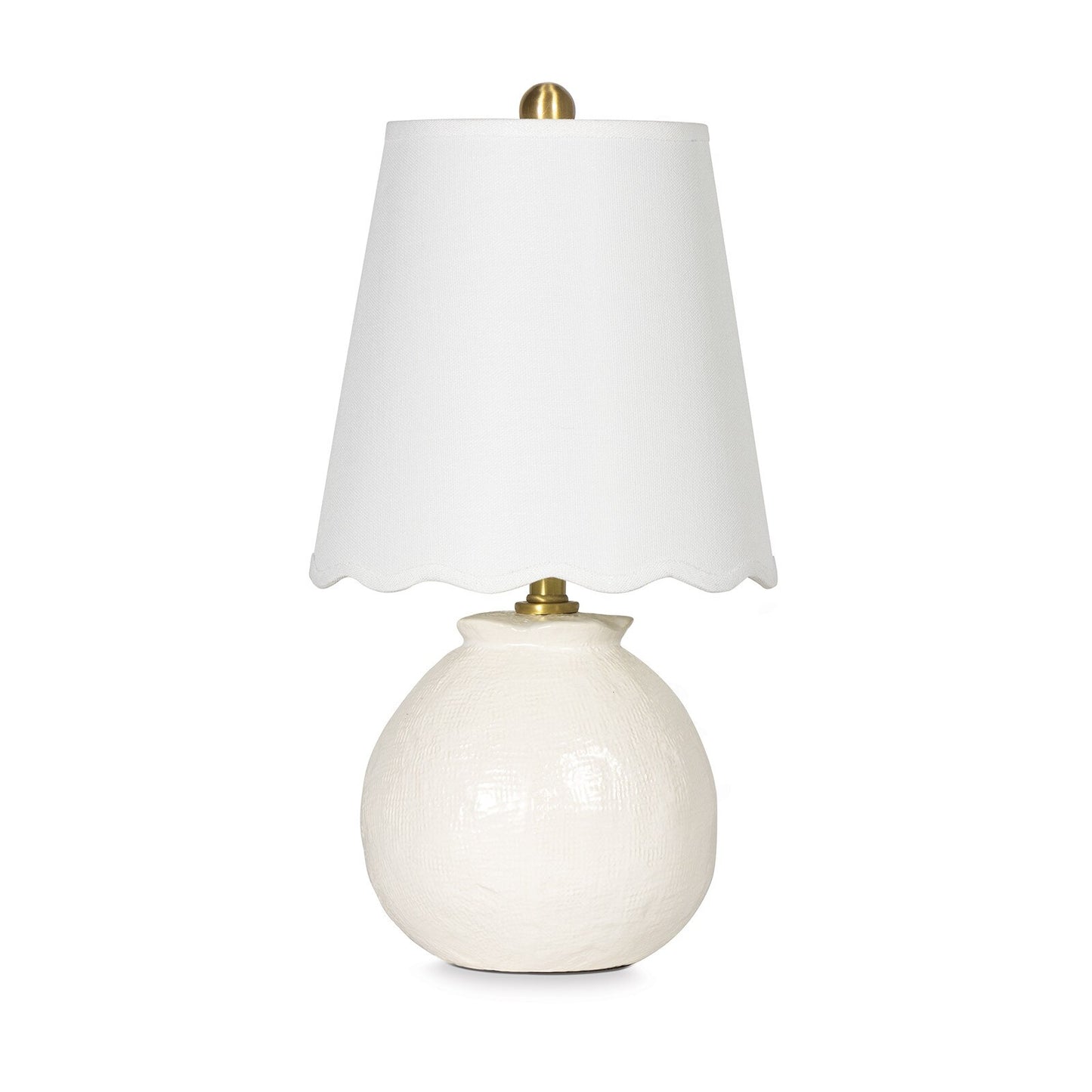 White table lamp with a scalloped white shade on a white background