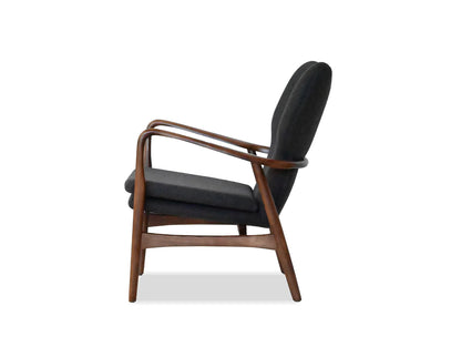 Black armchair with wooden frame on a white background