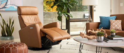 Brown recliner chair in a modern living room with decor elements.