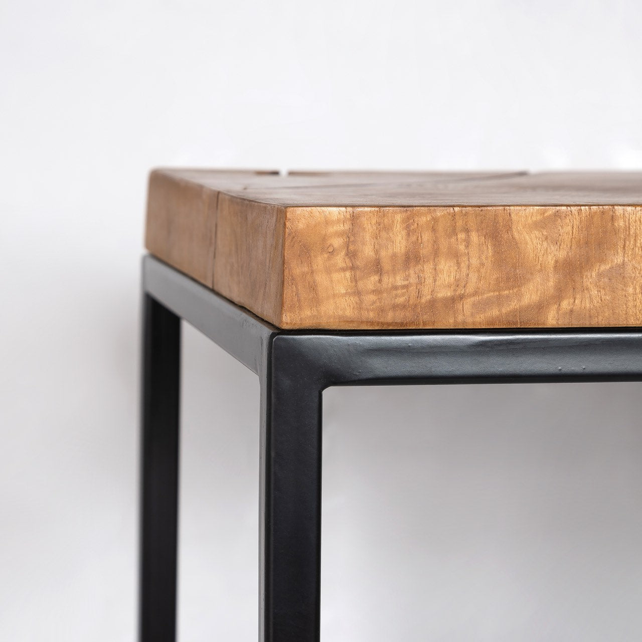 Wooden table with metal frame on a white background
