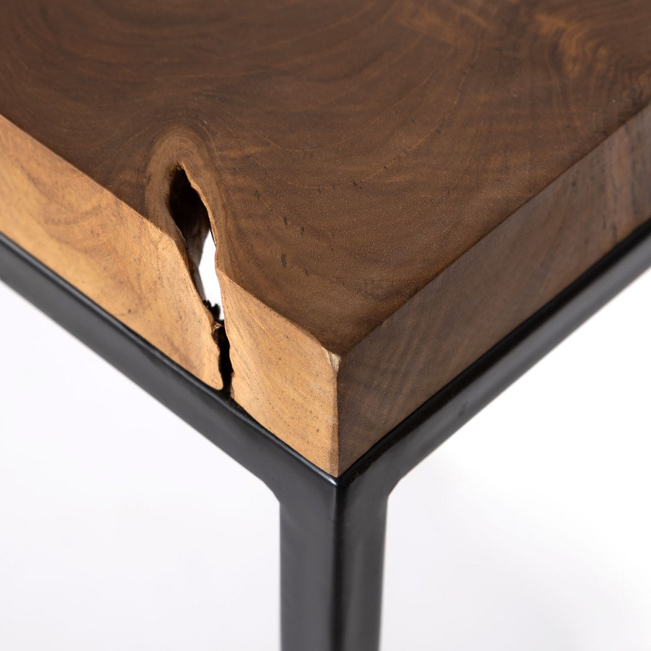 Wooden table with a black metal frame on a white background