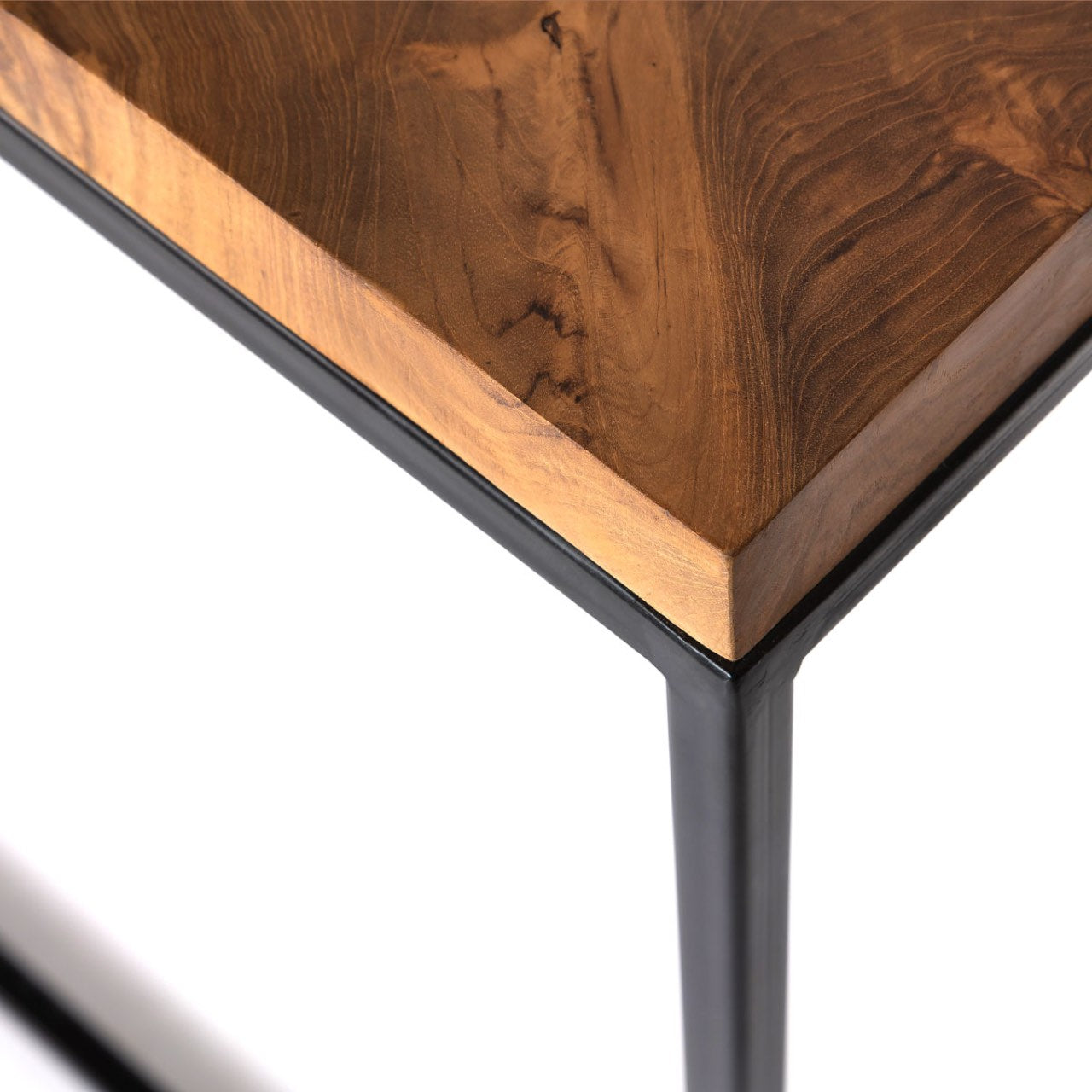 Wooden table corner with black metal leg on a white background