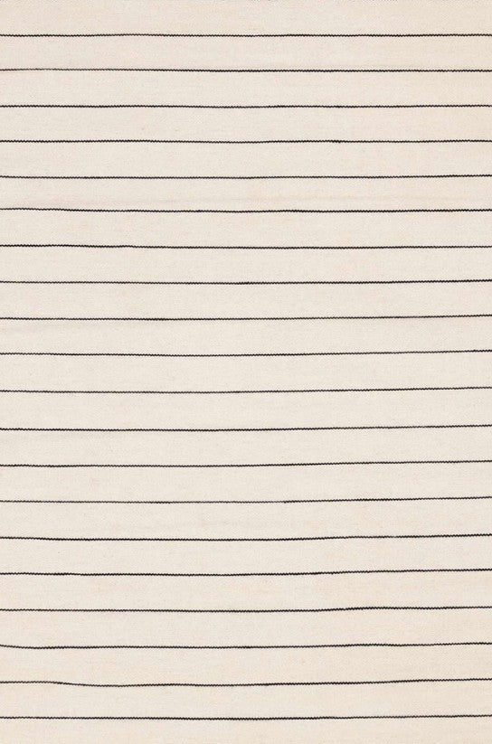 Close-up of a white rug with black lines 