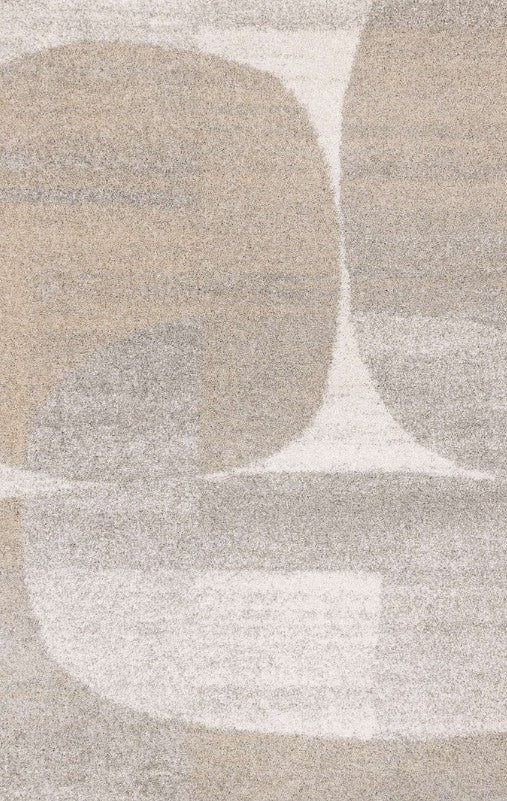 Close-up of a textured rug with abstract shapes in beige, brown, and white.
