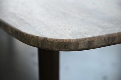 Close-up of a round marble table with a blurred background