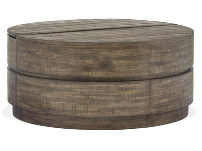 Round wooden ottoman with a weathered finish on a white background