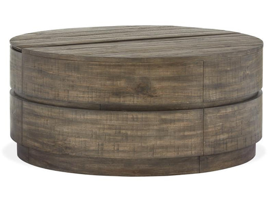 Round wooden ottoman with a weathered finish on a white background