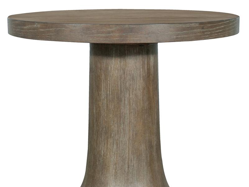 Round wooden table with a thick cylindrical base on a white background