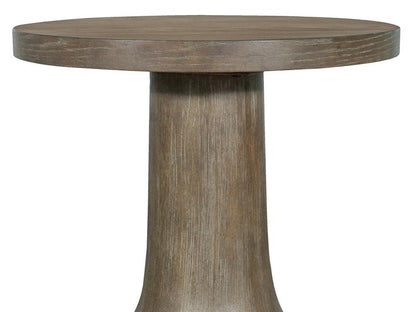 Round wooden table with a thick cylindrical base on a white background