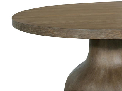 Wooden table with a round top and thick cylindrical base on a white background